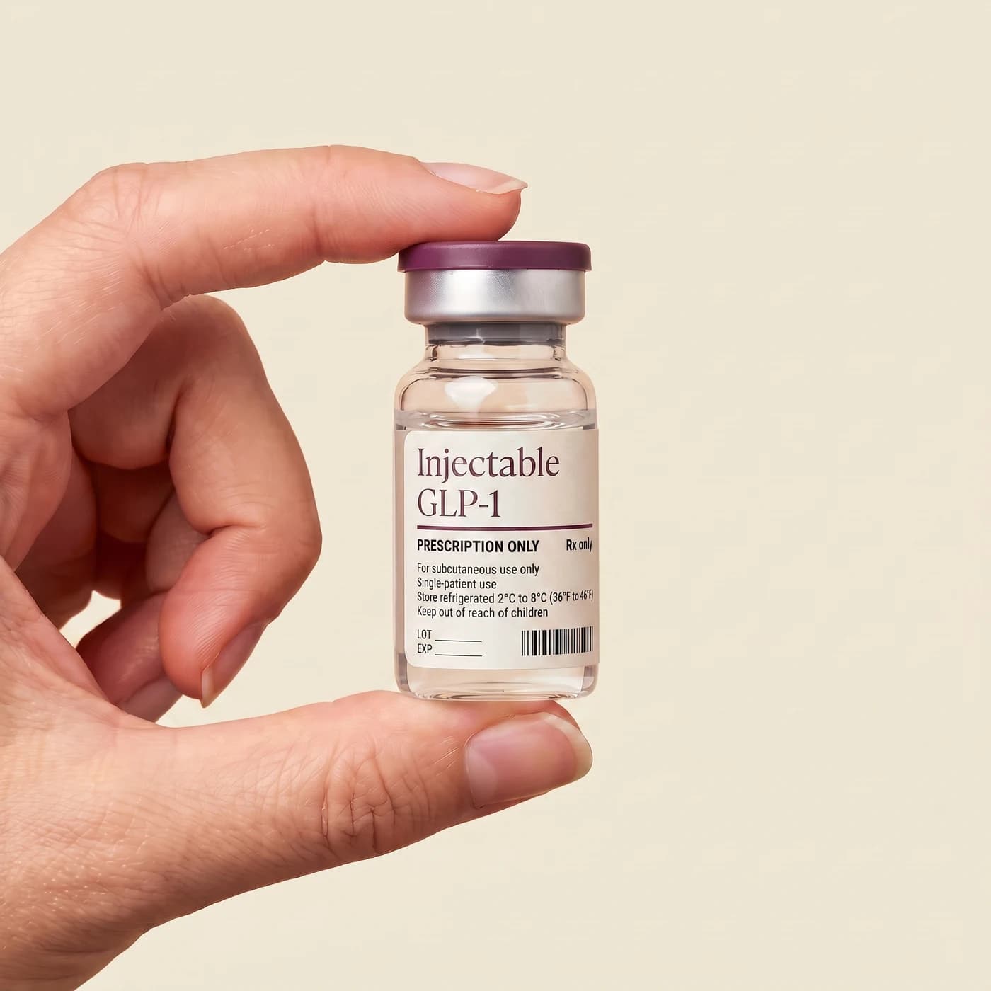 A hand holding a small medication vial labelled Injectable GLP-1, prescription only.